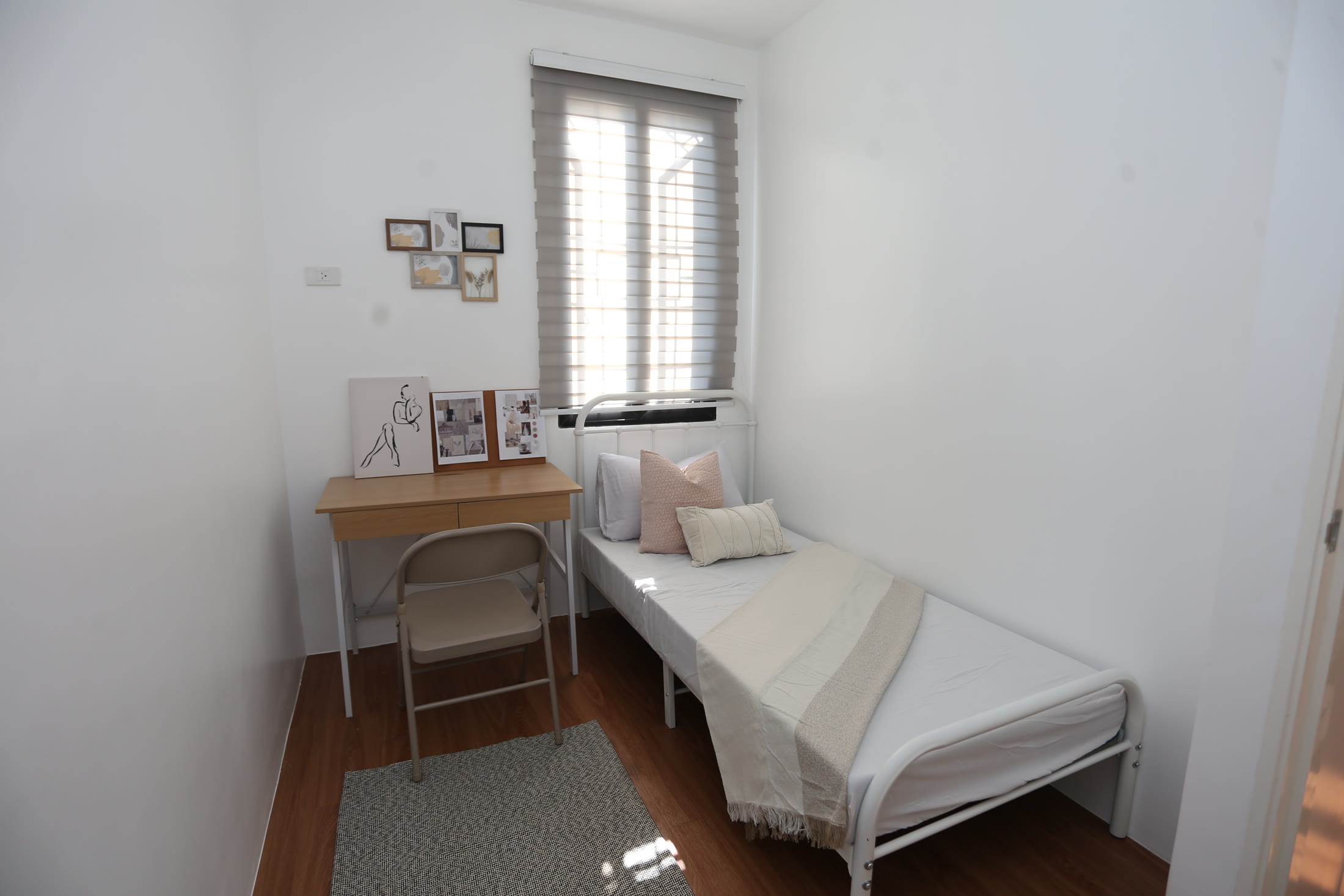 Bright Levana bedroom with a single bed and study desk
