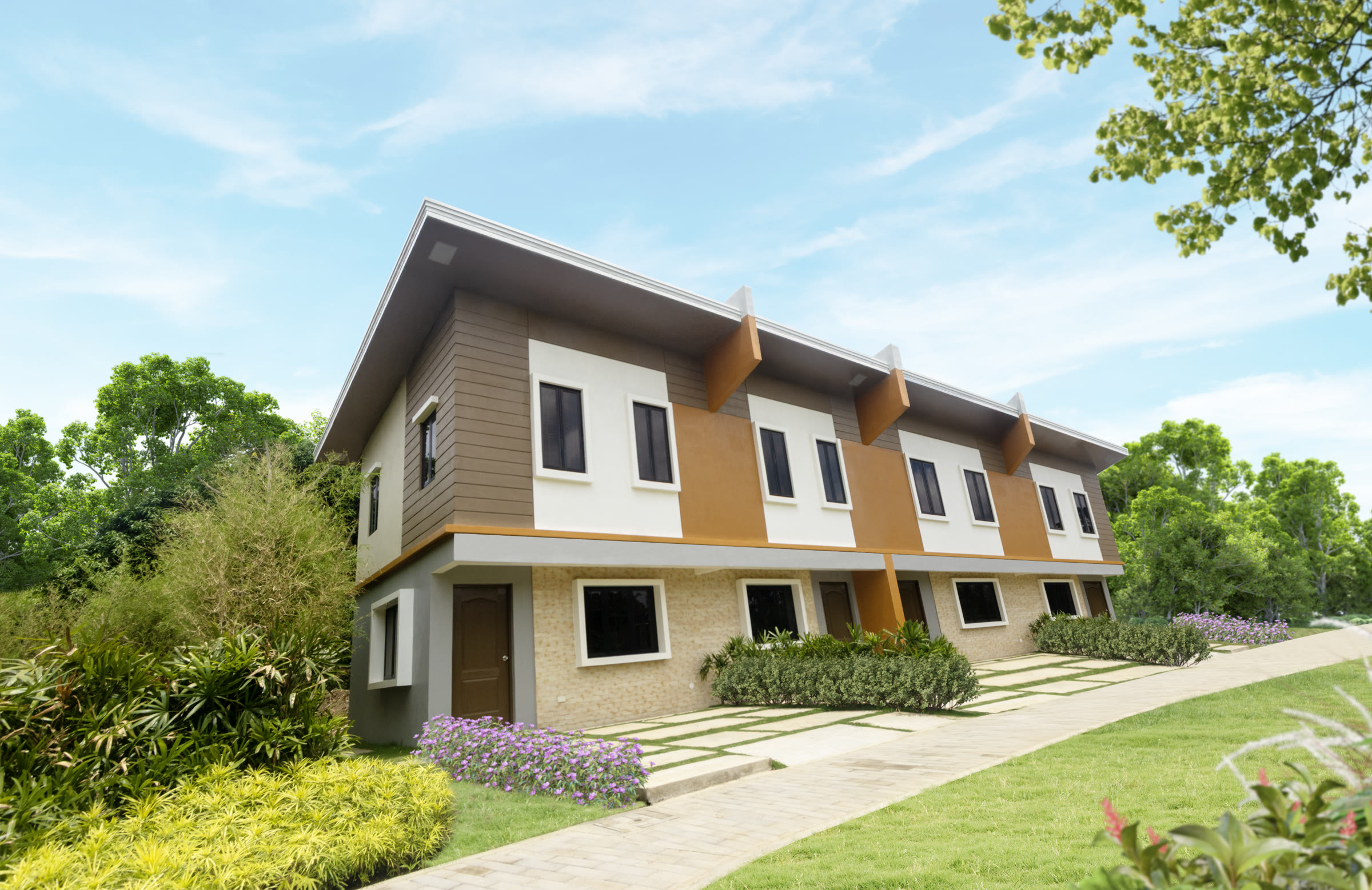 Levana townhomes at Estella framed by landscaped gardens under a bright blue sky