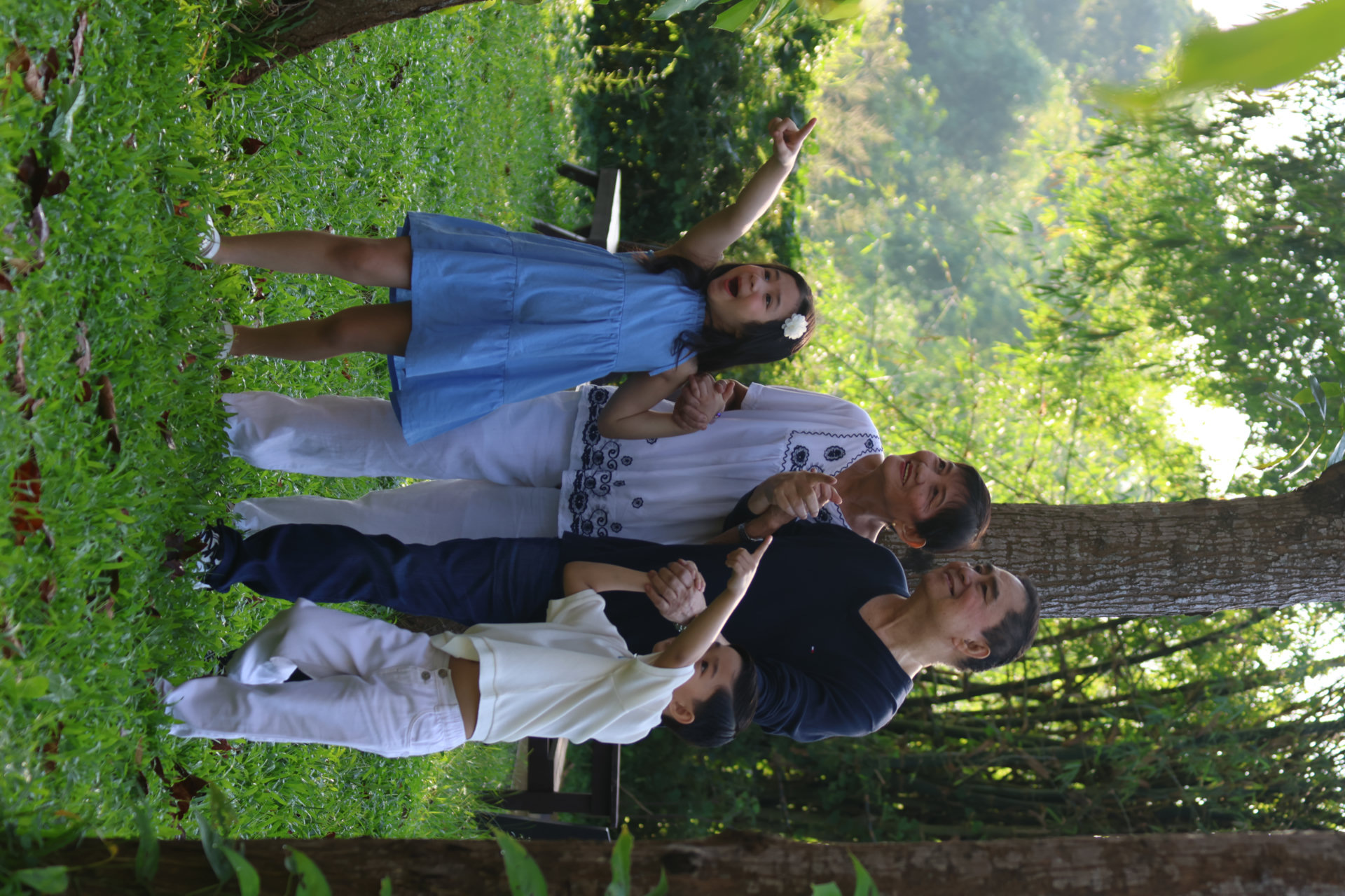 Grandparents sharing a nature walk with their grandchildren