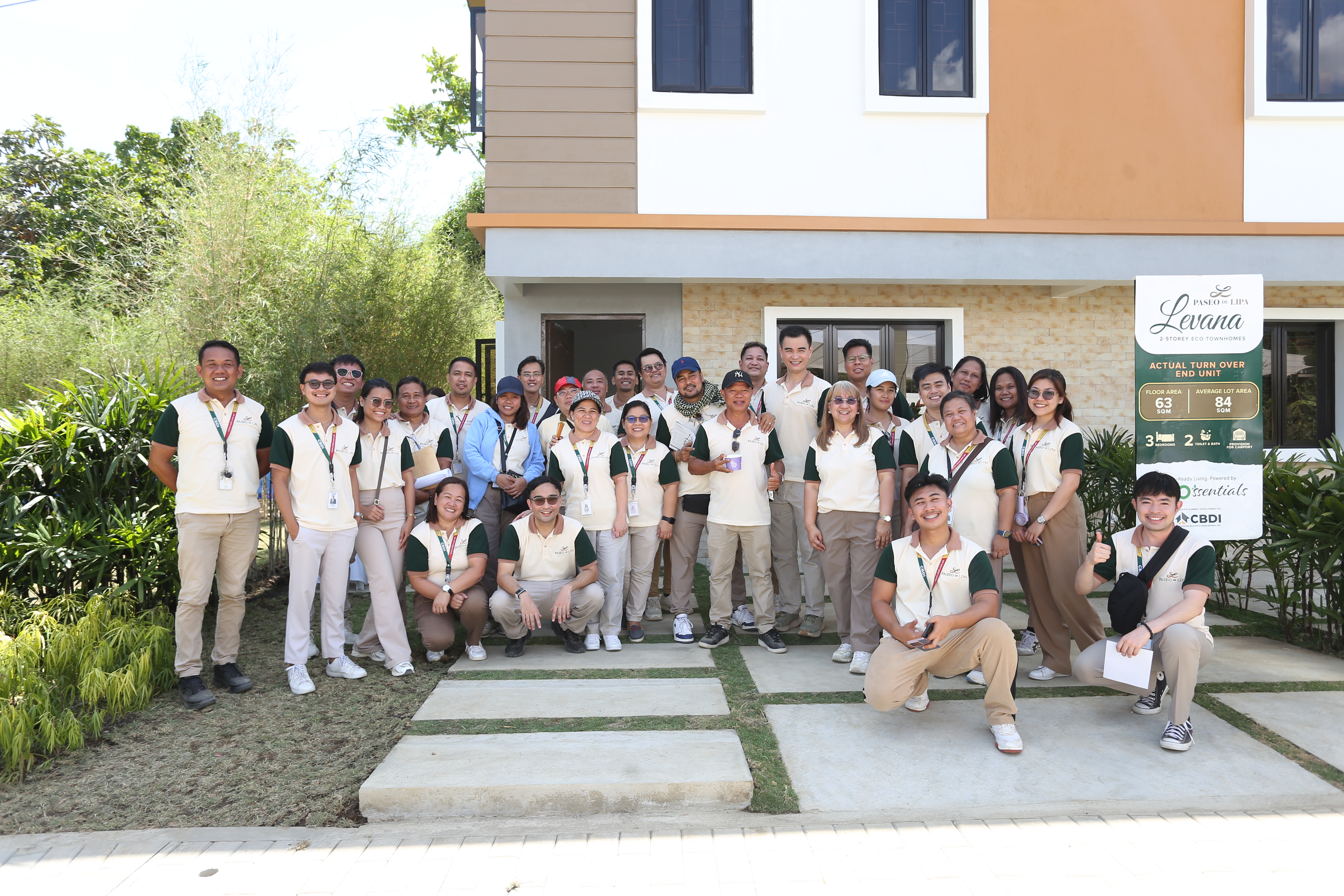 The Paseo de Lipa team gathered in front of a completed Levana home