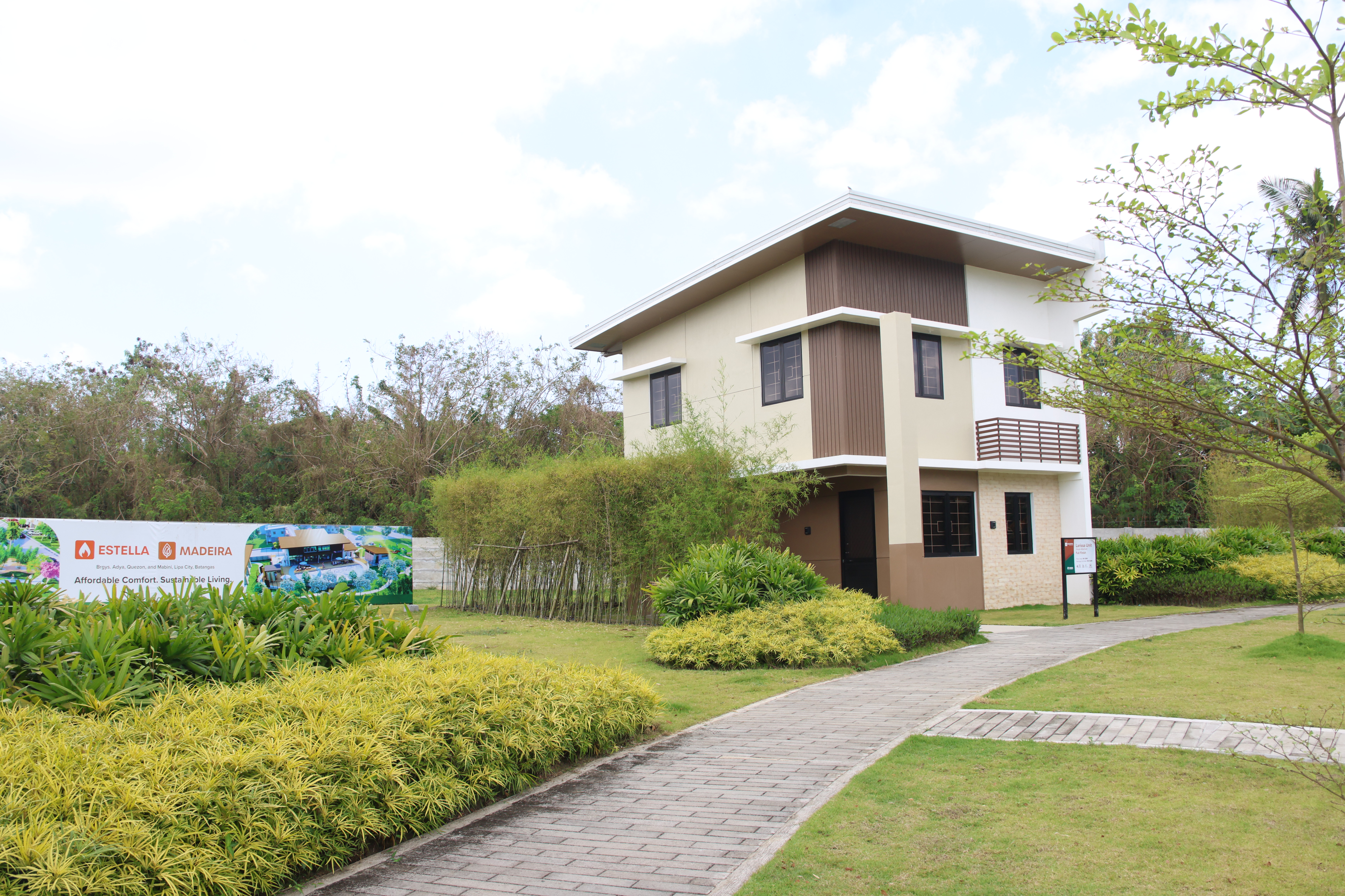 Contemporary model home surrounded by landscaped gardens at Paseo de Lipa